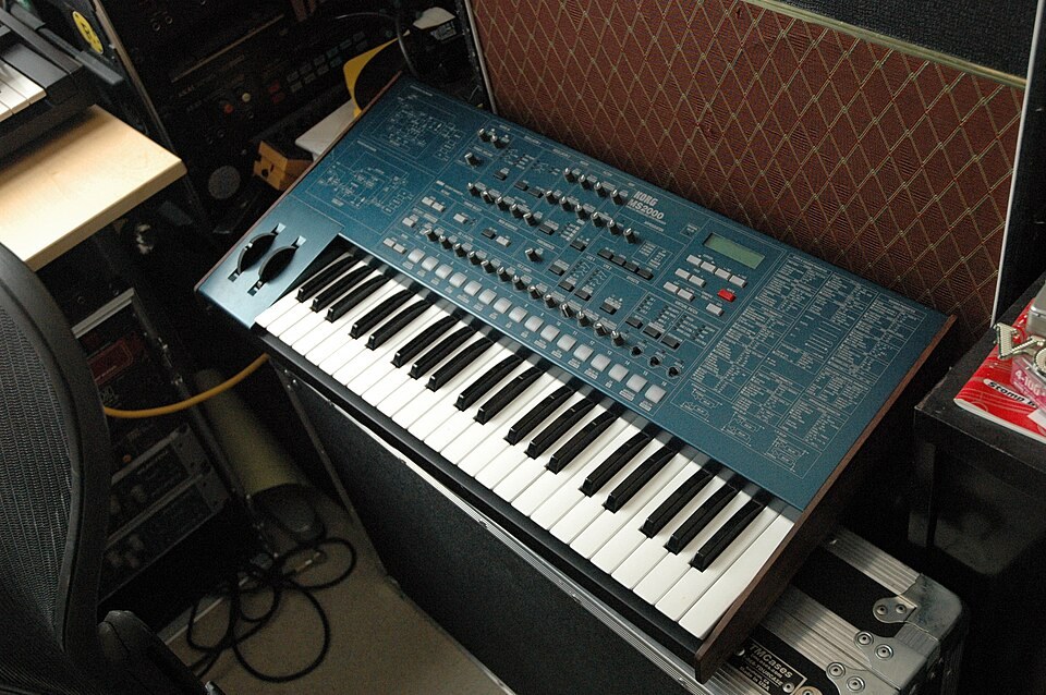 A Korg MS2000 synthesizer on an amplifier in a studio.