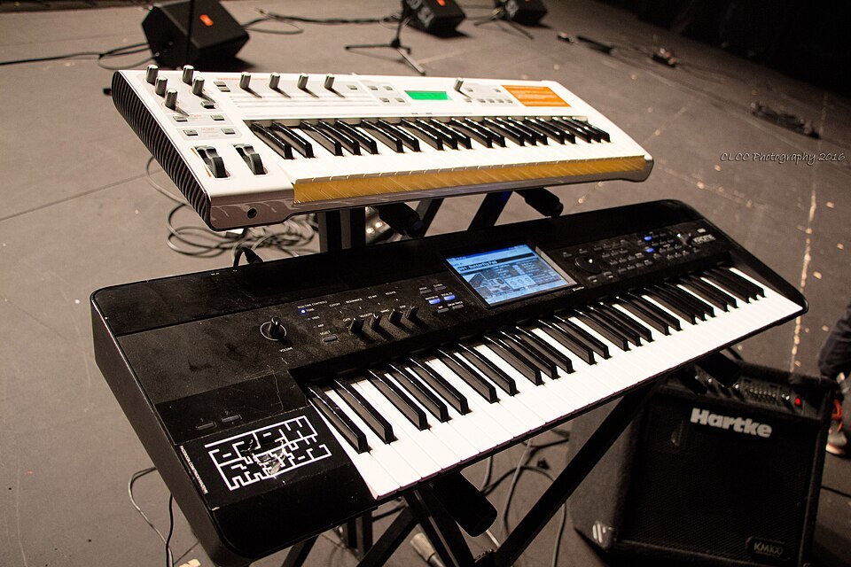 An M-Audio Venom synthesizer stacked on a Korg Krome keyboard.