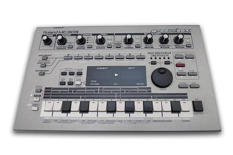 A silver Roland MC-303 Groovebox seen from above.