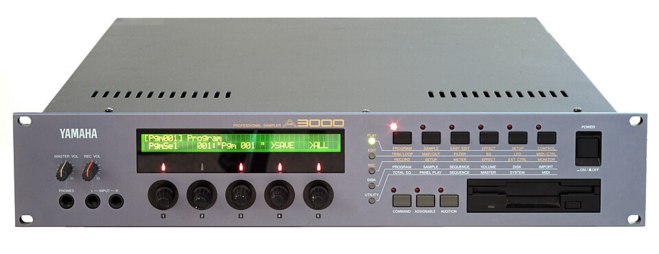 A Yamaha A3000 rack sampler with its display lit.