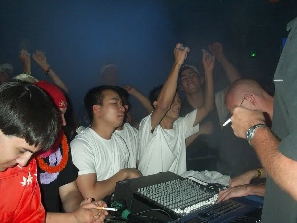 The audience cheering around the mixer.
