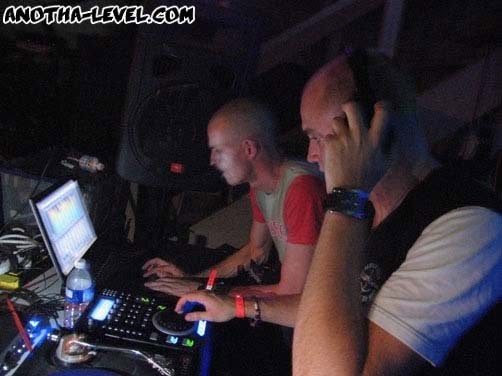 At the laptop and decks during the set.