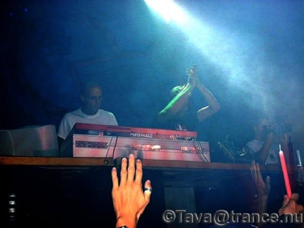 A hand on the Nord Lead 3 under blue stage light.