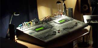 Mixing desks, 2001 The studio's mixing desks in the dark, their channel lights glowing.